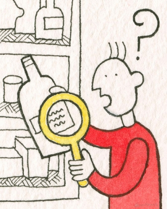 Picture of READING A BOTTLE LABEL WITH MAGNIFYING GLASS