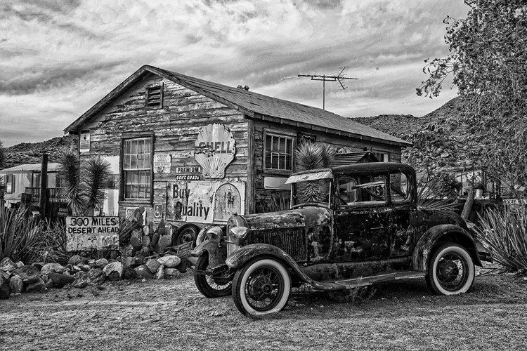 Picture of VINTAGE CAR IN FRONT OF OLD GAS STATION