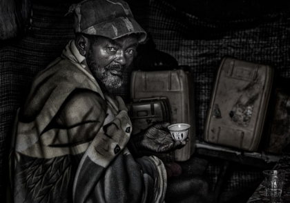 Picture of ETHIOPIAN MAN HAVING A CUP OF COFFEE.
