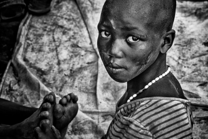 Picture of LARIM TRIBE GIRL MASSAGING FEET - SOUTH SUDAN