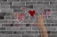 Picture of ABSTRACT OF BRICK WALL WITH HEARTS AND HAND