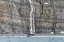 Picture of ZODIAC APPROACHING WATERFALL AND KING PENGUINS ON THE BEACH-GOLD HARBOUR-SOUTH GEORGIA-ANTARCTICA