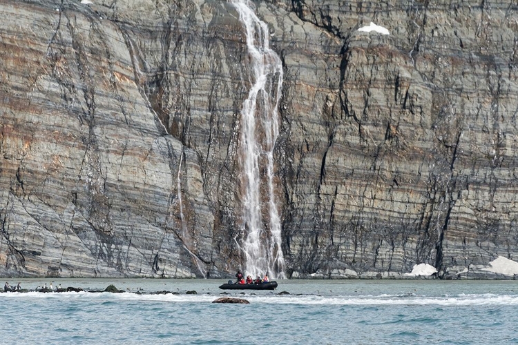 Picture of ZODIAC APPROACHING WATERFALL AND KING PENGUINS ON THE BEACH-GOLD HARBOUR-SOUTH GEORGIA-ANTARCTICA