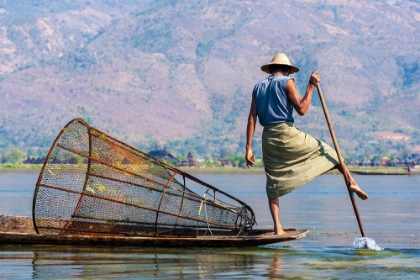 Picture of INLAY LAKE-SHAN STATE-MYANMAR-FISHERMAN BALANCES BETWEEN HIS CANOE AND POLE