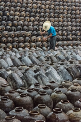 Picture of MAN IN THE MIDDLE OF BIG PILE OF WINE JARS-WUXI-JIANGSU PROVINCE-CHINA