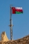 Picture of MIDDLE EAST-ARABIAN PENINSULA-OMAN-MUSCAT-MUTTRAH-OMANI FLAG FLYING IN MUTTRAH