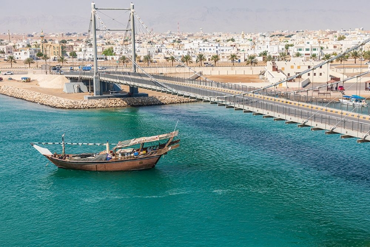 Picture of MIDDLE EAST-ARABIAN PENINSULA-OMAN-AL BATINAH SOUTH-DHOW PASSING UNDER A SUSPENSION BRIDGE