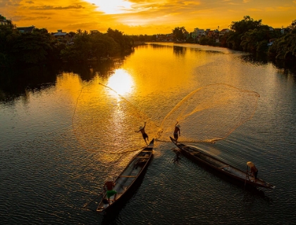 Picture of VIETNAM-COORDINATED LAGOON FISHING WITH NETS AT SUNSET