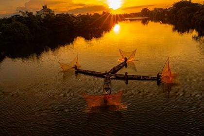 Picture of VIETNAM-COORDINATED LAGOON FISHING WITH NETS AT SUNSET