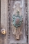 Picture of ITALY-VENICE-BURANO ISLAND CLOSEUP OF BRASS DETAIL ON AN OLD WOODEN DOOR ON BURANO ISLAND