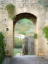 Picture of ITALY-CHIANTI-MONTERIGGIONI LOOKING OUT AN ARCHED ENTRANCE INTO THE WALLED TOWN