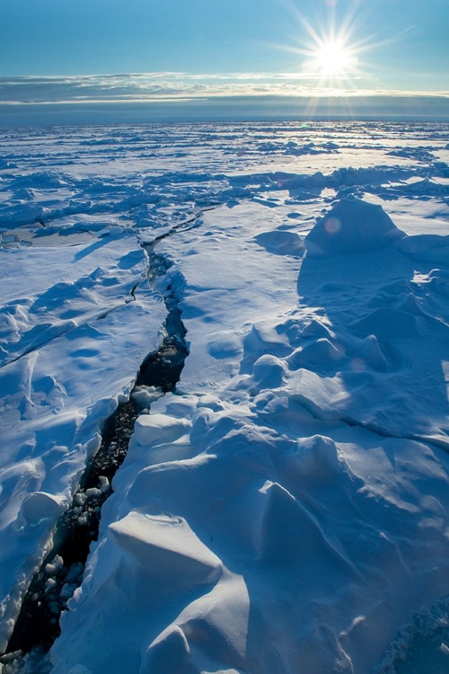 Picture of NORWAY ICESCAPE AT 84 DEGREES NORTH-CRACK IN ICE WITH SUNBURST