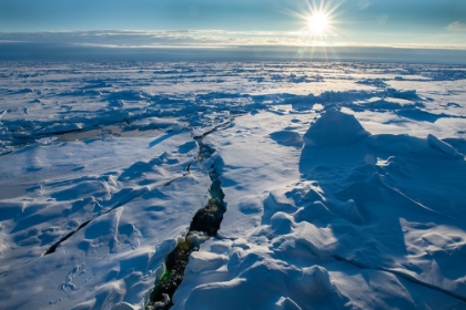 Picture of NORWAY ICESCAPE AT 84 DEGREES NORTH-CRACK IN ICE WITH SUNBURST