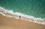 Picture of EUROPE-PORTUGAL-NAZARE-GIRL IN SURF ON BEACH