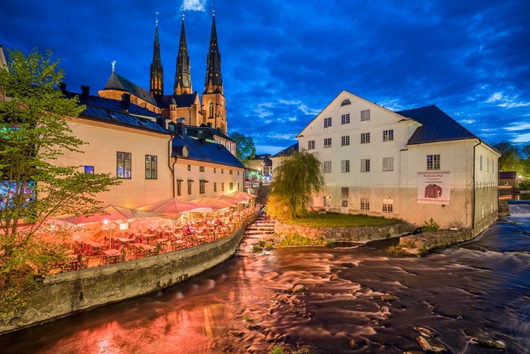 Picture of SWEDEN-CENTRAL SWEDEN-UPPSALA-DOMKYRKA CATHEDRAL WITH RIVERFRONT CAFE-DUSK