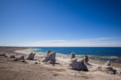 Picture of SWEDEN-FARO ISLAND-LANGHAMMARS AREA-LANGHAMMAR COASTAL LIMESTONE RAUK ROCKS WITH VISITORS