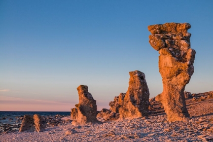 Picture of SWEDEN-FARO ISLAND-LANGHAMMARS AREA-LANGHAMMAR COASTAL LIMESTONE RAUK ROCK-SUNSET