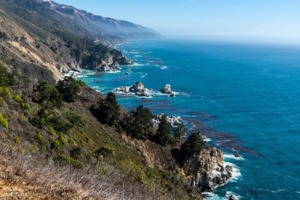 Picture of THE RUGGED COASTLINE OF BIG SUR-CALIFORNIA WITH WISPS OF FOG FLOATING INTO THE HILLS