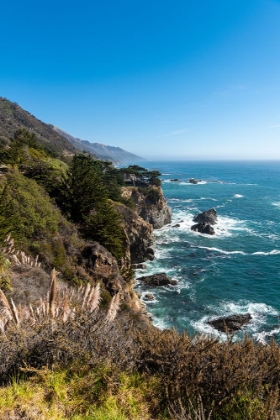 Picture of THE RUGGED COASTLINE OF BIG SUR WITH WISPS OF FOG DRIFTING INTO THE HILLS