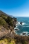Picture of THE RUGGED COASTLINE OF BIG SUR WITH WISPS OF FOG DRIFTING INTO THE HILLS