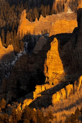 Picture of USA-COLORADO-GUNNISON NATIONAL FOREST SUNRISE ON CLIFFS AND FOREST IN AUTUMN