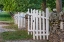 Picture of GATE AND WHITE WOODEN FENCE AND ROCK WALL-SHAKER VILLAGE OF PLEASANT HILL-HARRODSBURG-KENTUCKY