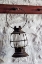 Picture of ANTIQUE LANTERN HANGING ON WHITE WALL-SHAKER VILLAGE OF PLEASANT HILL-HARRODSBURG-KENTUCKY