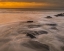 Picture of USA-NEW JERSEY-CAPE MAY NATIONAL SEASHORE SUNRISE ON ROCKY SHORELINE