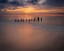 Picture of USA-NEW JERSEY-CAPE MAY NATIONAL SEASHORE SUNRISE ON PIER POSTS ON OCEAN SHORE