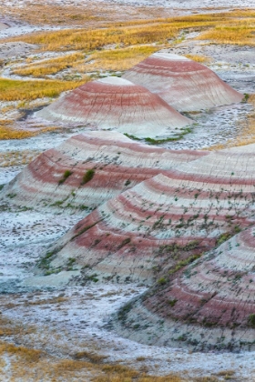Picture of A HALF CIRCLE OF ROUNDED MOUNDS OR HOODOO-SHARPLY STRIATED WITH REDS