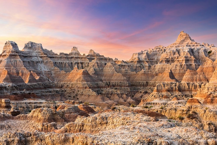 Picture of MAGNIFICENT SET OF STRIATED HOODOOS SET AGAINST THE BACKDROP OF SUNSET COLORS IN THE SKY