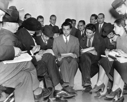Picture of ORSON WELLES WITH REPORTERS AFTER THE WAR OF THE WORLDS RADIO BROADCAST, 1938
