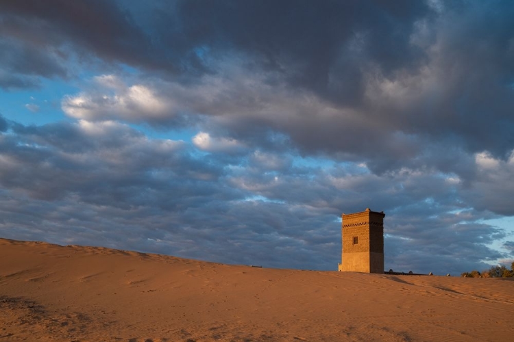 Picture of WATER TOWER GLOWS ORANGE IN SUNRISE LIGHT.