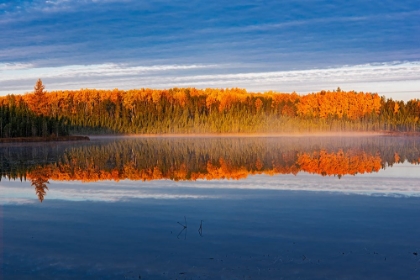 Picture of CANADA- MANITOBA- DUCK MOUNTAIN PROVINCIAL PARK. MORNING FOG ON LAKE IN AUTUMN.