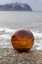 Picture of NORWAY- LOFOTEN ISLANDS- VAREID. MOUNTAINS AND OCEAN VIEWED THROUGH A GLASS BALL