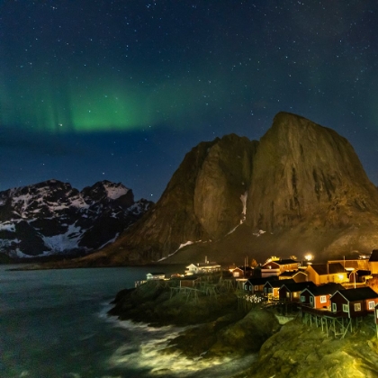 Picture of NORWAY- LOFOTEN ISLANDS. AURORA BOREALIS IN THE SKY ABOVE HAMNOY IN REINE