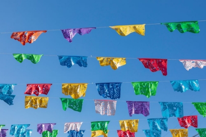 Picture of TODOS SANTOS- BAJA CALIFORNIA SUR- MEXICO. FESTIVE COLORFUL BANNERS OVER A STREET.