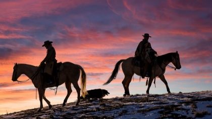 Picture of USA- SHELL- WYOMING. HIDEOUT RANCH COWGIRLS AND DOG SILHOUETTED AGAINST SUNSETS SKY. 