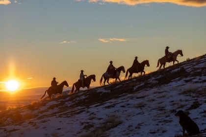 Picture of USA- WYOMING. HIDEOUT HORSE RANCH- WRANGLERS ON HORSEBACK IN SNOW AT SUNSET. 