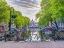 Picture of BICYCLES PARKED ALONG THE CANAL, AMSTERDAM