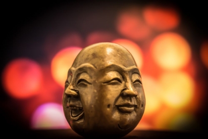 Picture of A BRASS FIGURINE DEPICTING TWO SMILING FACES OF BUDDHA