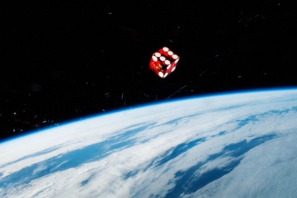 Picture of A DICE FLOATING IN SPACE ABOARD THE ISS