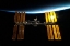 Picture of THE INTERNATIONAL SPACE STATION BACKDROPPED BY EARTH’S HORIZON