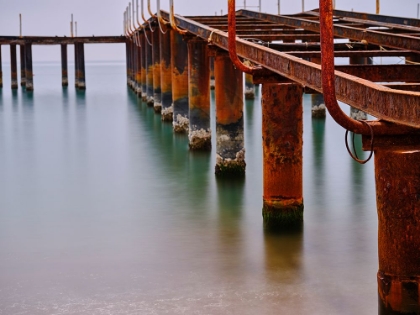 Picture of OLD PIER ON THE BEACH AND LONG EXPOSURE SEA WAVES