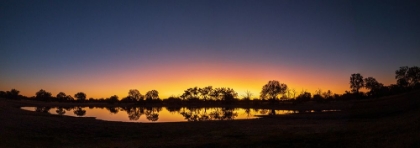 Picture of COLORFUL SUNSET AT WATERING HOLE. CAMELTHORN LODGE. HWANGE NATIONAL PARK. ZIMBABWE.