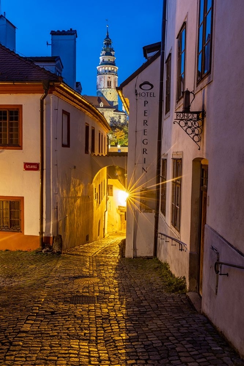 Picture of NARROW COBBLESTONE STREETS AT DUSK WITH CASTLE TOWER IN HISTORIC CESKY KRUMLOV-CZECH REPUBLIC.