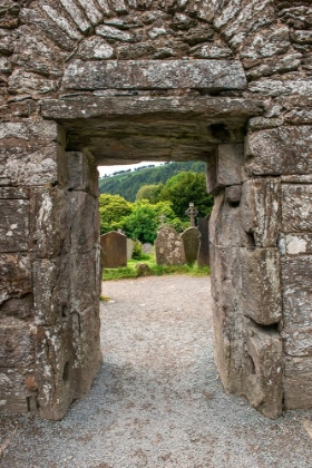 Picture of ANCIENT DOOR MARKS THE PASSAGEWAY BETWEEN THE OLD CHURCH AND GRAVEYARD AT GLENDALOUGH MONASTERY.