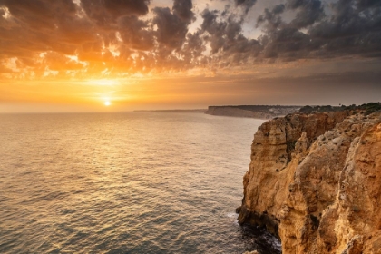 Picture of DRAMATIC SUNSET CLOUDS OVER CLIFFS ALONG THE COAST AT PONTA DA PIEDADE IN LAGOS-PORTUGAL