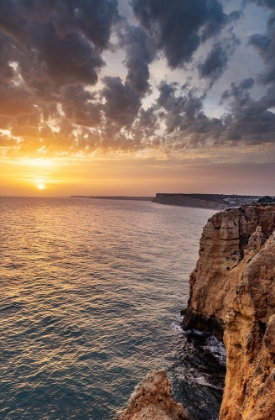 Picture of DRAMATIC SUNSET CLOUDS OVER CLIFFS ALONG THE COAST AT PONTA DA PIEDADE IN LAGOS-PORTUGAL