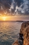 Picture of DRAMATIC SUNSET CLOUDS OVER CLIFFS ALONG THE COAST AT PONTA DA PIEDADE IN LAGOS-PORTUGAL